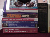userpic of a pair of dark glasses on a pile of books